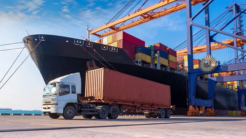 Port logistics operations showing cargo containers, cranes, and transportation infrastructure management